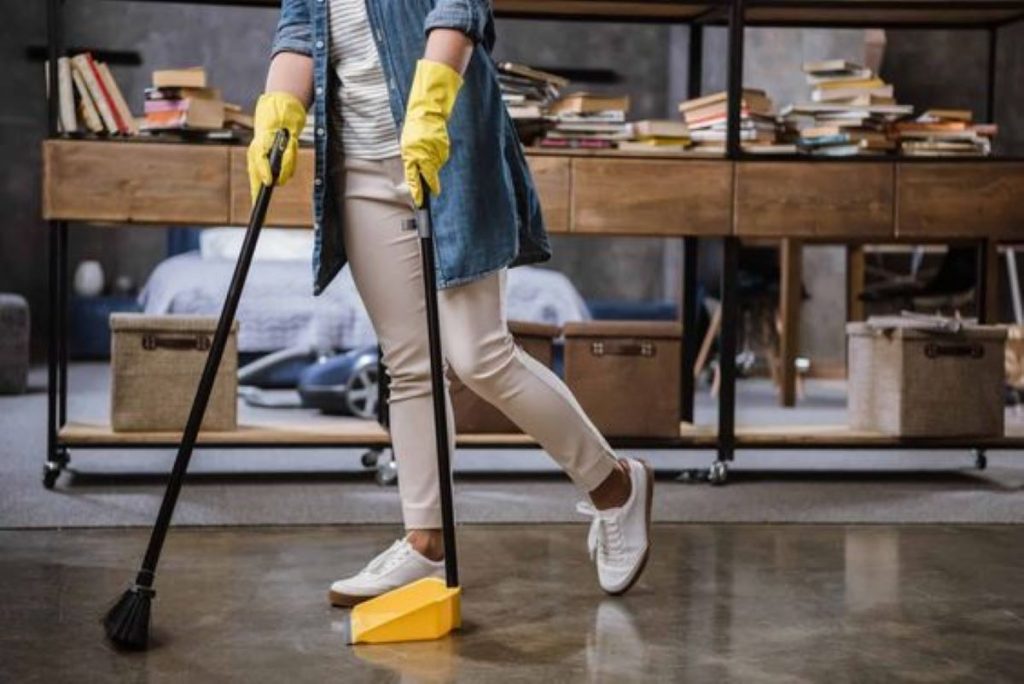 Woman cleaner cleaning the floor